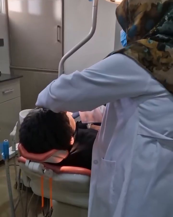 Dr. Tabassum Ajmal with a patient in the treatment room